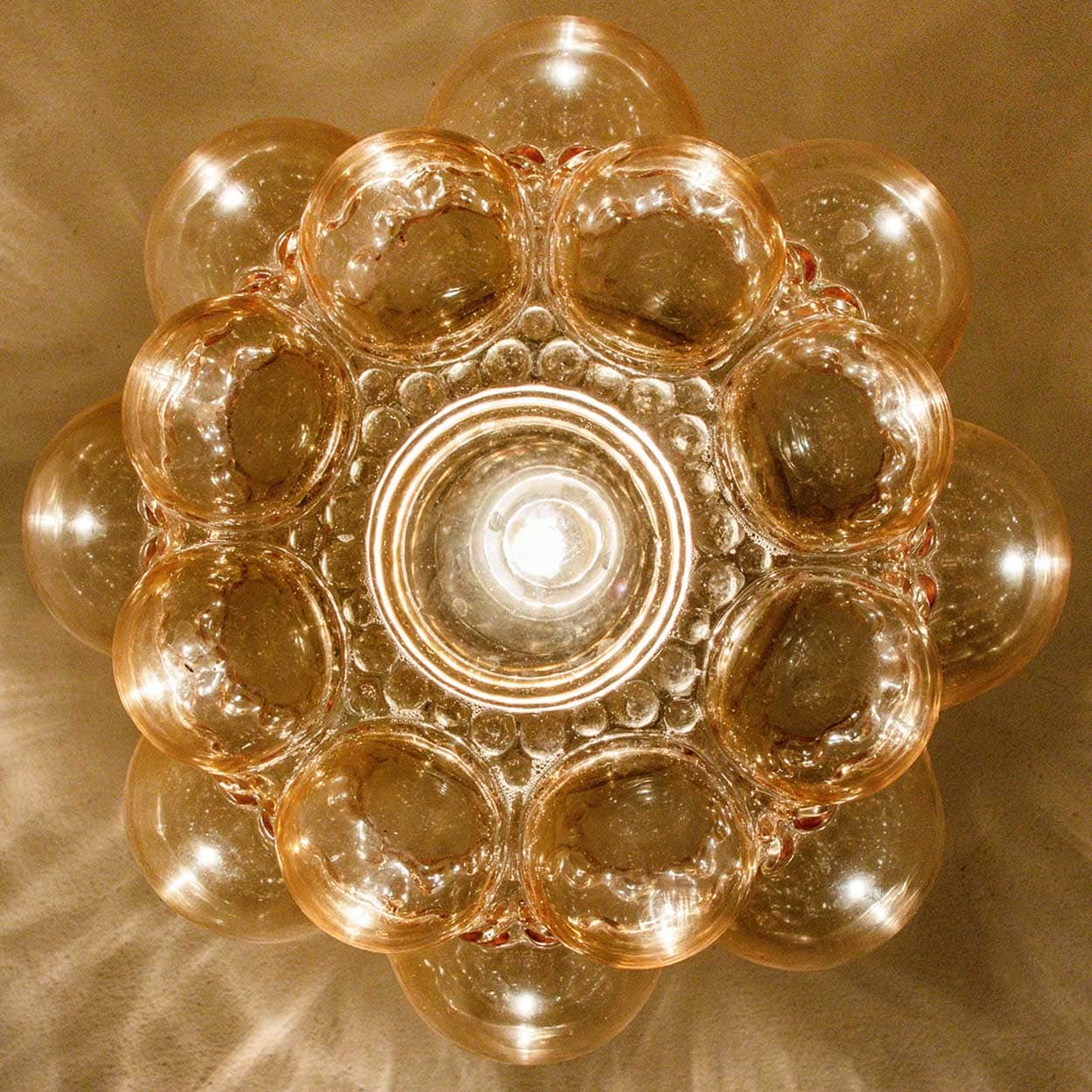 1 of the 2 Amber Bubble Glass Pendant Light Fixtures by Helena Tynell, 1960