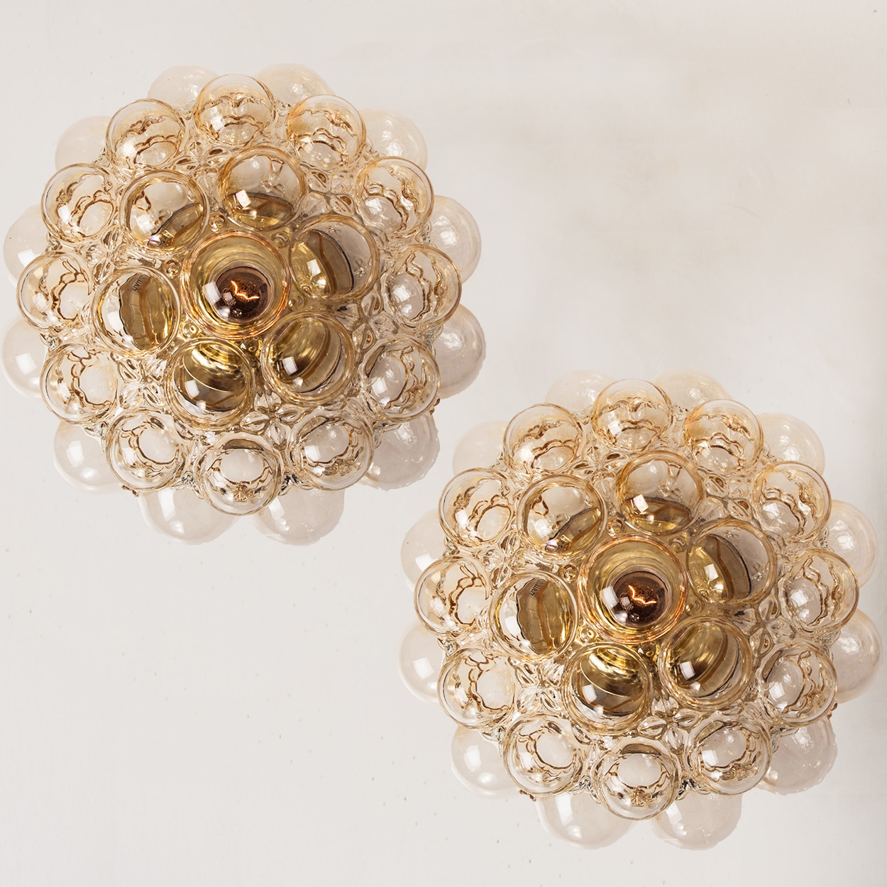 1 of the 2 Amber Bubble Glass Pendant Light Fixtures by Helena Tynell, 1960