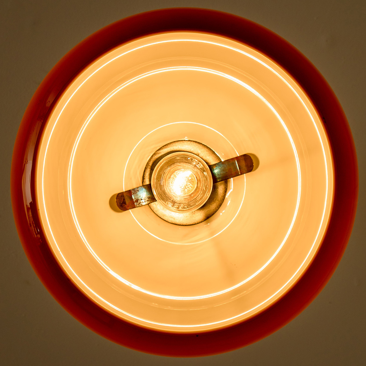 1 of the 2 Brown Orange Chrome Pendant Lights by Harvey Guzzini, 1970s