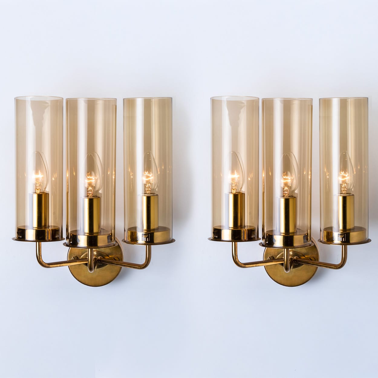 Pair of Brass and Amber Glass Wall Lights by Jakobsson, 1960