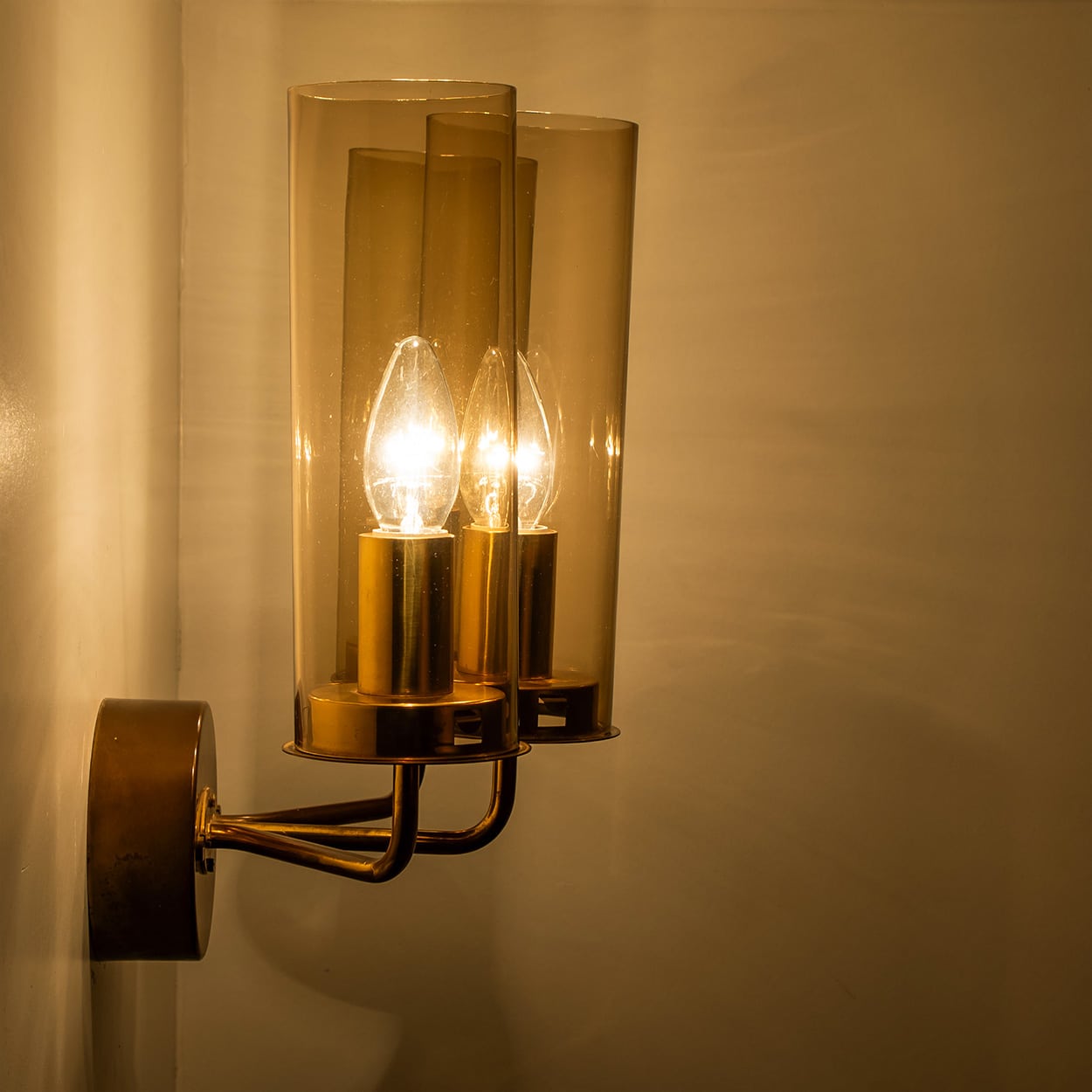 Pair of Brass and Amber Glass Wall Lights by Jakobsson, 1960