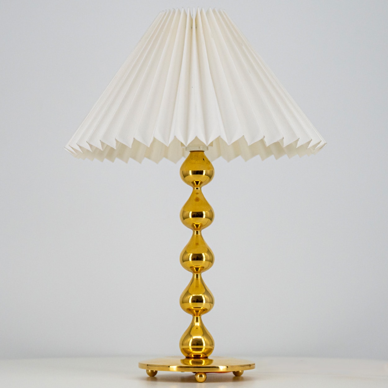 Pair of Asmussen 24 carat Gold plated Drops Table Lamps with Pleated Lampshade