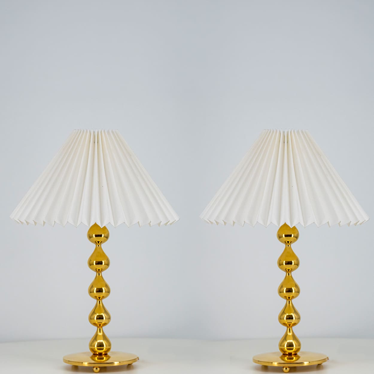 Pair of Asmussen 24 carat Gold plated Drops Table Lamps with Pleated Lampshade