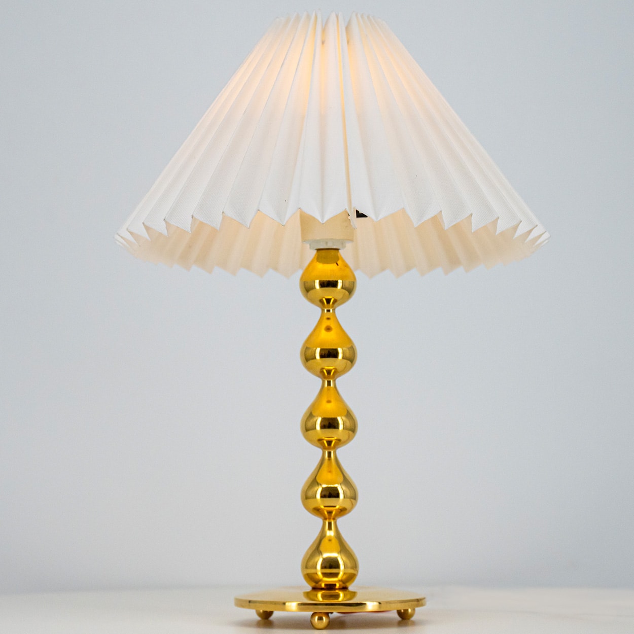 Pair of Asmussen 24 carat Gold plated Drops Table Lamps with Pleated Lampshade