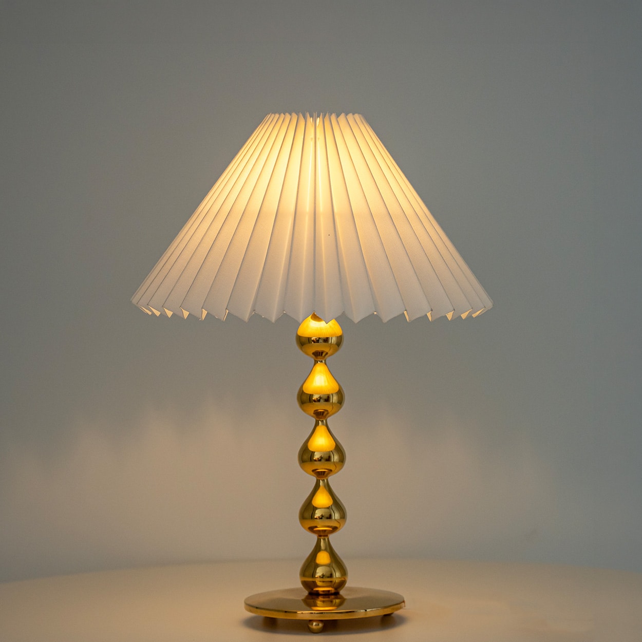 Pair of Asmussen 24 carat Gold plated Drops Table Lamps with Pleated Lampshade
